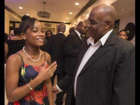 
Tsenaye Lewis (left), female awardee for table tennis, speaks with President of the Jamaica Table Tennis Association Godfrey Lothian during the RJRGLEANER National Sportsman and Sportswoman of the year Awards at The Jamaica Pegasus on Friday, January 18, 2019. 