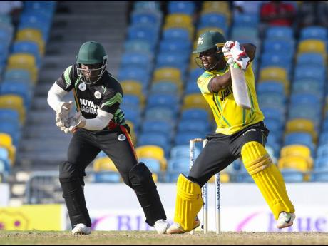 AT TOP: Jamaica Scorpions’ Nkrumah Bonner (right) plays a shot for four runs during their Super50 Cup match against the Guyana Jaguars at the Kensington Oval on October 25, 2018.