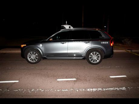 This March 18, 2018 file image provided by the Tempe Police Department shows an Uber SUV after hitting a woman in Tempe, Arizona. Documents released Tuesday, November 5, 2019 by the National Transportation Safety Board raise questions about whether a self-driving Uber SUV that ran down a pedestrian last year should have been allowed on public roads for test purposes. 
