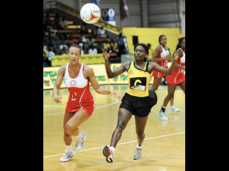 Jamaica’s Khadijah Williams (right) runs ahead of England’s Serena Guthrie in their final game of their three-Test Supreme Ventures Sunshine Series at the National Indoor Sports Centre in 2013. England won 50-36 