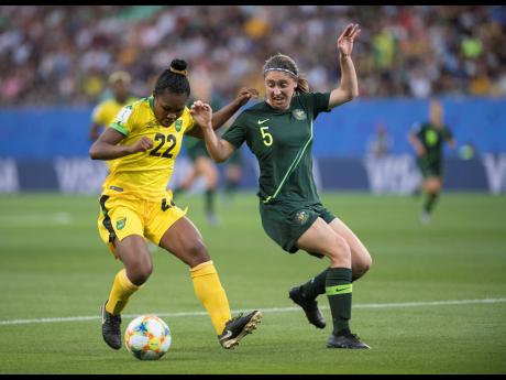 Jamaica’s Mireya Grey is challenged by Australia’s Karly Roestbakken during their FIFA Women’s World Cup match at Stade des Alpes in Grenoble, France on Tuesday, June 18, 2019.