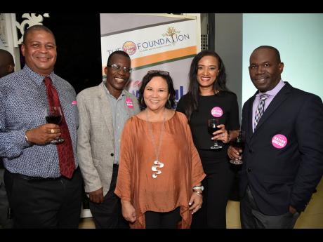 Directors of Honey Bun Foundation (from left): Robert Scott,  Dr Lawrence Nicholson, Michelle Chong, founder of the foundation,  Nashauna Lalah, general manager, and Howard James during the launch of the foundation on the grounds of Devon House on Tuesday.