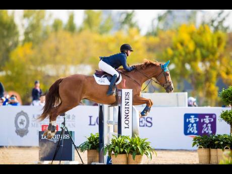 
Jamaican rider Rachael Chandley in competition at the Federation Equestre Internationale CSIO for Juniors and Young Riders in Tianjin, China, where she placed second. 