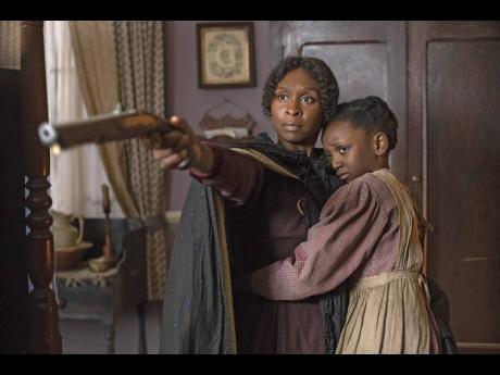 Cynthia Erivo as Harriet Tubman and Aria Brooks as Anger at age eight in ‘Harriet’.