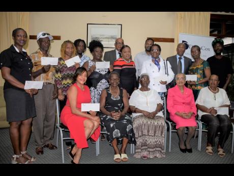 Individuals and representatives for various charities and organisations at the handover of funds willed by former resident of 
St Thomas Phyllis Neita, totalling $13 million dollars, at the Alhambra Inn in St Andrew on Thursday, November 14.