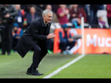 Tottenham’s manager José Mourinho calls out to his players during the English Premier League match between West Ham and Tottenham, at London Stadium, in London yesterday. Tottenham won 3-2.