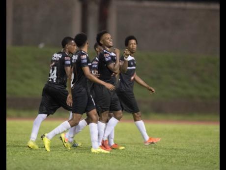 Cavalier FC players celebrate a goal scored by Alex Marshall (second right) during a Red Stripe Premier League game on Sunday, September 15, 2019.
