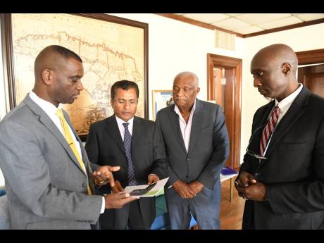 President of The Mico University College, Dr Asburn Pinnock (left), talks with Indian High Commissioner M. Sevala Naik (second left) about a private-sector-led initiative to construct a US$1m STEM Centre at the Kingston campus. The centre will serve all 14 parishes through satellite centres. With them are Cari-Med boss Glen Christian (second right), who is leading the project, and Mico’s Dr Albert Benjamin. They met at The Gleaner last Thursday to discuss the project. 