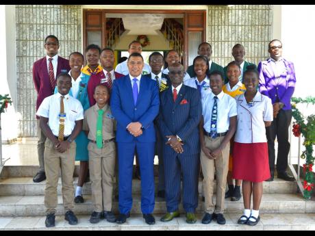 Prime Minister Andrew Holness (third left, front row) and Minister of Local Government and Community Development Desmond McKenzie (third right, front row) with youth mayors and youth councillors from the 14 municipalities across the island during a courtesy call at Jamaica House in St Andrew on Wednesday.