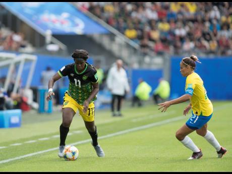 Jamaica’s Khadija Shaw (left) in action against Brazil captain Monica in the FIFA Women’s World Cup 2019 at the Stade des Alpes in Grenoble, France, on Sunday June 9, 2019. Brazil won the match 3-0.
