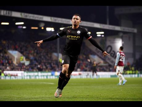 Manchester City’s Gabriel Jesus celebrates after scoring his side’s first goal of the game against Burnley during their Premier League match at Turf Moor in Burnley, England, yesterday. Jesus scored twice in City’s 4-1 win.