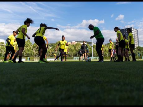 Assistant coach Lorne Donaldson (third right) joins Jamaica’s senior women’s football team in training drills at a session at Stade Eugene Thenard in Grenoble, France, on Sunday June 16, 2019, ahead of their FIFA Women’s World Cup Group C match against Australia. 