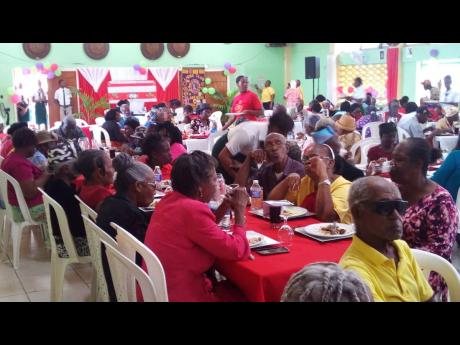 Senior citizens from Hayes, Clarendon, enjoying being pampered by sixth-formers at Vere Technical High School.