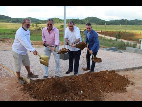 Agriculture Minister Audley Shaw (second right) participates in the groundbreaking for Organic Growth Holdings Incorporated’s (OGH) medicinal hemp farm at Swanwick in Trelawny. From left are: Mitchel Yeckes, managing director of OGH; Robert Weinstein, co-founder and president of OGH; and Shawn Rogers, vice-president, OGH. 