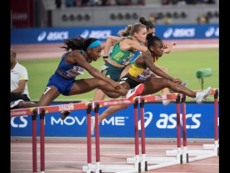 Megan Tapper (right) competing in the Women’s 100m hurdles semi-final at the 2019 IAAF World Athletics Championships held at the Khalifa International Stadium in Doha, Qatar, on Sunday, October 6, 2019. 