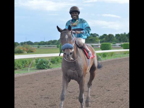 Dane Nelson is all smiles after winning aboard Princess Ava at Caymanas Park yesterday.