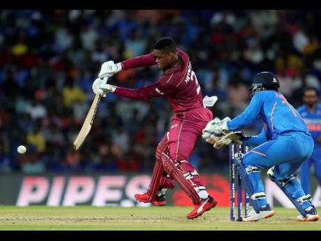 Windies batsman Shimron Hetmyer (left) plays a stroke during the first One Day International cricket match against India in Chennai, India, yesterday.