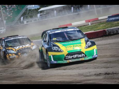 Jamaican driver Fraser McConnell takes his black, green, and gold race car around the track during action at the Canadian leg of the ARX2 Championship earlier this year.