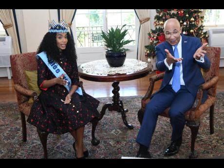 Sir Patrick Allen, governor general of Jamaica, appears to say to Miss World 2019, Toni-Ann Singh, that the floor is hers during a courtesy call at King’s House on Monday, December 23.