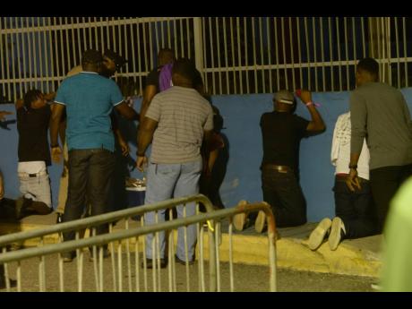 Four suspects are accosted by the police at Sabina Park on Friday morning after a soca event.