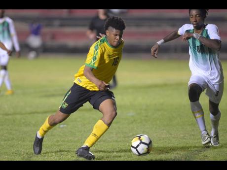 Jamaica’s Nicque Daley (left) dribbles forward as Dominican defender Jolly Fitz looks to close him down during their Concacaf Men’s Under 23 Olympic Qualifying match at the Anthony Spaulding Sports Complex in Kingston on Wednesday, July 17, 2019. Daley was a member of Jamaica’s Under 22 team that went down 9-0 to Japanese counterparts in the Kirin Challenge Cup in Nagasaki, Japan on Saturday.