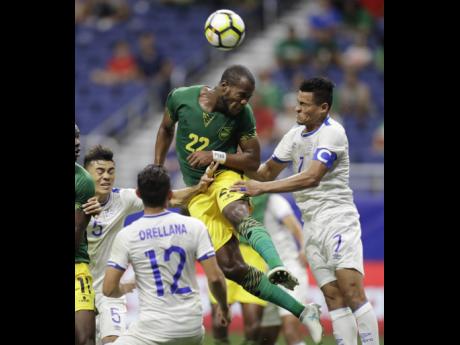 Jamaica’s Romario Williams (centre) tries to put a header on goal  against El Salvador during a CONCACAF Gold Cup match in San Antonio in July 2017. The game ended 1-1.