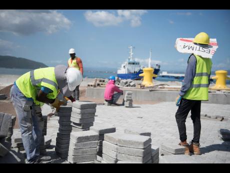 Labourers are seen at the Old Coal Wharf worksite that houses the Port Royal pier on Friday ahead of the arrival of the Marella Discover 2 cruise ship scheduled to visit the town on Monday, January 20. 