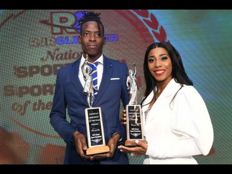 Sportsman of the Year 2019 Tajay Gayle (left) and Sportswoman of the Year 2019 Shelly- Ann Fraser-Pryce pose with their trophies at the RJRGLEANER Sports Foundation National Sportsman and Sportswoman of the Year Awards 2019, which was held at the Jamaica Pegasus hotel last Friday night. 