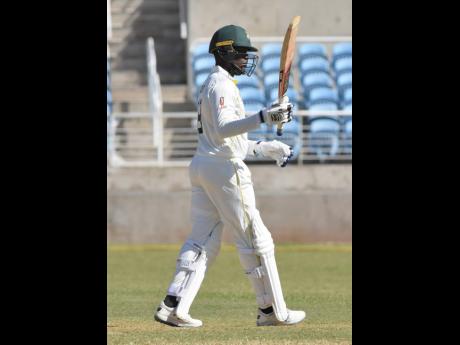 Ian Allen Nkrumah Bonner from the Jamaica Scorpions acknowledges the spectators during his knock of 100 not out in the CWI Regional Four Day cricket match against the Windward Islands Volcanoes at Sabina Park yesterday.