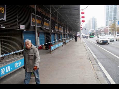 This January 17, 2020 photo shows the closed Huanan Seafood Wholesale Market in Wuhan, China. China reported on Monday a sharp rise in the number of people affected in a pneumonia outbreak caused by a new coronoavirus, including the first cases in the capital. 