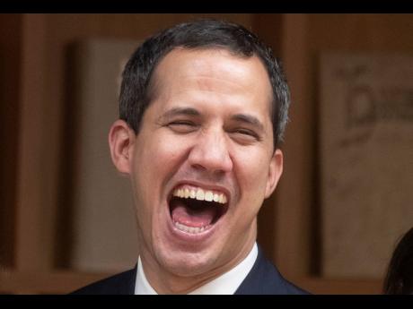The leader of Venezuela’s political opposition, Juan Guaidó, laughs after a meeting at the Madrid regional government building during a visit to Madrid, Spain, on Saturday.