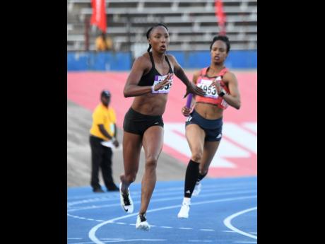 Sherone Simpson (left) receives the baton from Anastasia Le-Roy in the women’s 4x100m relay to carry the Sprintec Track Club team to victory at the Gibson McCook Relays held at the National Stadium on Saturday, February 23, 2019.