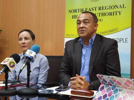 Health Minister Dr Christopher Tufton addresses journalists at a press conference in Ocho Rios, St Ann, on Friday. To his right is Foreign Affairs and Foreign Trade Minister Kamina Johnson Smith. Jamaica has imposed a ban on China travel because of the novel coronavirus outbreak.