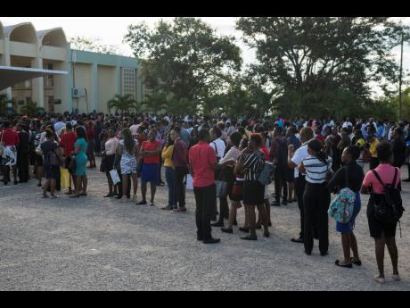Scores of prospective recruits throng the National Police College of Jamaica in Twickenham Park, St Catherine, on Saturday, January 18, 2020, during a recruitment drive. 