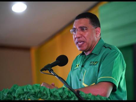 Prime minister and party leader Andrew Holness addressing the Jamaica Labour Party's Area Council Two meeting at the Portmore HEART Academy in St Catherine.