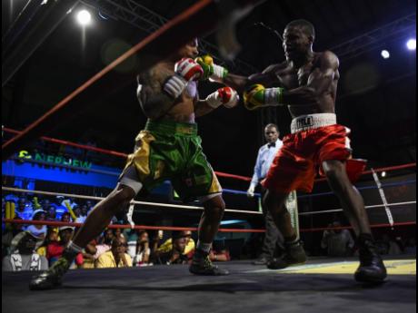 Jamaica’s Nico Yeyo faces off against Canada’s Mayron Zefferino during a Wray & Nephew Contender Series match at the Chinese Benevolent Association Auditorium on Wednesday, April 11, 2018.