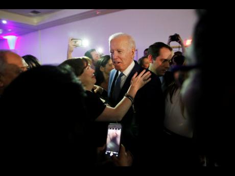 Democratic presidential candidate, former Vice-President Joe Biden, meets with people at the Clark County Democratic Party Kick-Off to Caucus 2020 event on Saturday in Las Vegas.