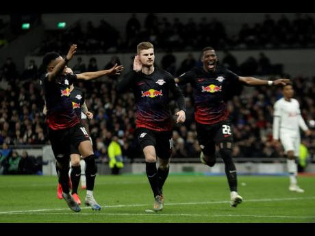 Leipzig’s Timo Werner (center) celebrates after scoring his side’s goal during a first leg, round of 16, UEFA Champions League match against Tottenham Hotspur at the Tottenham Hotspur Stadium in London, England yesterday.