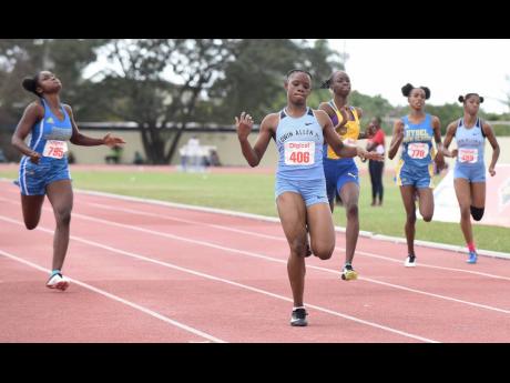 Tina Clayton (second left) of Edwin Allen High wins the Class Two Girls 200m final in 23.57 seconds ahead of Hydel High’s Shenese Walker (left), Clarendon College’s Dejanea Oakley (centre), Machaeda Linton (second right) of Hydel, and Shenequa Vassell of Edwin Allen, at the Digicel Central Championships at the G.C. Foster College of Physical Education and Sport in Spanish Town, St Catherine, on Wednesday.