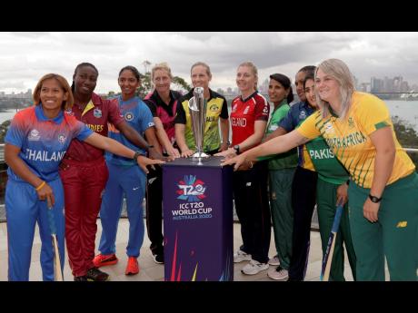 The captains of the 10 countries participating in the ICC Women’s Twenty20 World Cup pose for a photo with the trophy in Sydney, Australia, on Monday. The tournament begins today. From left are, Sornnarin Tippoch of Thailand, Stafanie Taylor of West Indies, Harmanpreet Kaur of India, Sophie Devine of New Zealand, Meg Lanning of Australia, Heather Knight of England, Salma Khatun of Bangladesh. Chamari Atapattu of Sri Lanka, Bismah Maroof of Pakistan and Dane van Niekerk of South Africa.