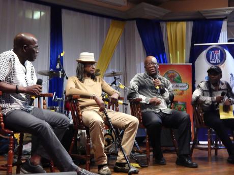 
Moderator Dr Dennis Howard (left) listens to the panellists – (from second left) Sly Dunbar, Christopher Irving, and Franklin Irving – talk about Channel One Studio at the Institute of Jamaica Lecture Hall at East and Tower streets in downtown Kingston, last Sunday.