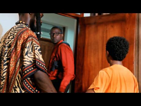 Sgt Miles (centre), played by YouTuber Kevin Swaby, takes a second glance at Pressure T (Delroy Johnson, left) and Miguel (Emmanuel Nunes-Chavez) in a scene from ‘Your Day Is Tomorrow’.