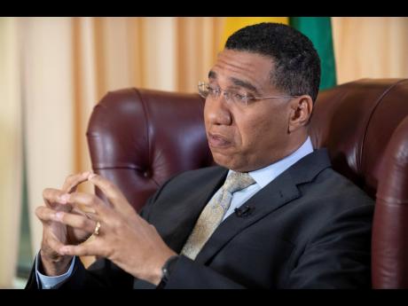 Prime Minister Andrew Holness responding to a question from a Gleaner news team on Tuesday. 