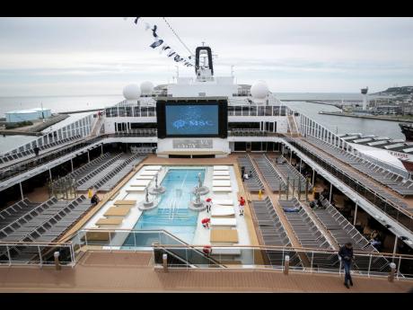 This June 3, 2017 file photo shows the upper deck pool area of the MSC Meraviglia cruise ship docked in Le Havre harbour, Normandy, France. The cruise ship was turned away in February  2020 by two nations, Grand Cayman and Jamaica, after it reported one crew member from the Philippines was sick with common seasonal flu, and was being allowed to dock at Mexico’s Caribbean island of Cozumel and passengers would be allowed to disembark, President Andrés Manuel López Obrador said Thursday.