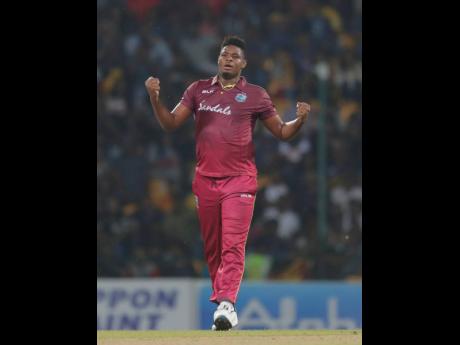 West Indies’ bowler Oshane Thomas celebrates the dismissal of Sri Lanka’s Dasun Shanaka during their first Twenty20 cricket match in Pallekele, Sri Lanka, yesterday. The West Indies won by 25 runs. 