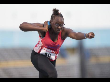 Camperdown High’s Britannie Johnson competing in the Under 17 girls shot put at yesterday’s opening day of the 2020 Carifta Trials at the National Stadium. Johnson won the event with a throw of 13.69 metres. 
