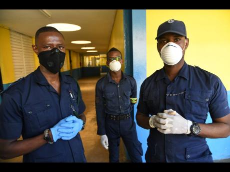 Members of the Department of Correctional Services wearing face masks during a tour of the Horizon Adult Remand Centre in Kingston on Friday.