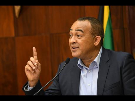 Dr Christopher Tufton, minister of health and wellness, addresses a press conference on COVID-19 at Jamaica House on Monday. He hosted a digital briefing on Zoom yesterday.