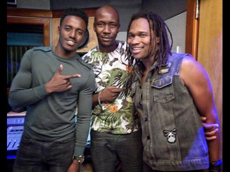 Producer Frankie Campbell of Frankie Music Productions (centre) hangs out with Romain Virgo (left) and Kumar Bent during a studio session. 