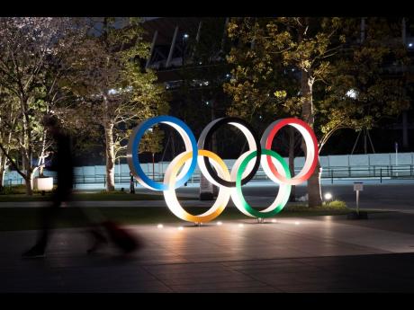 The Olympic rings are seen yesterday, in Tokyo. The Tokyo Olympics will open next year in the same time slot scheduled for this year’s Games. Tokyo organisers said yesterday the opening ceremony will take place on July 23, 2021. 